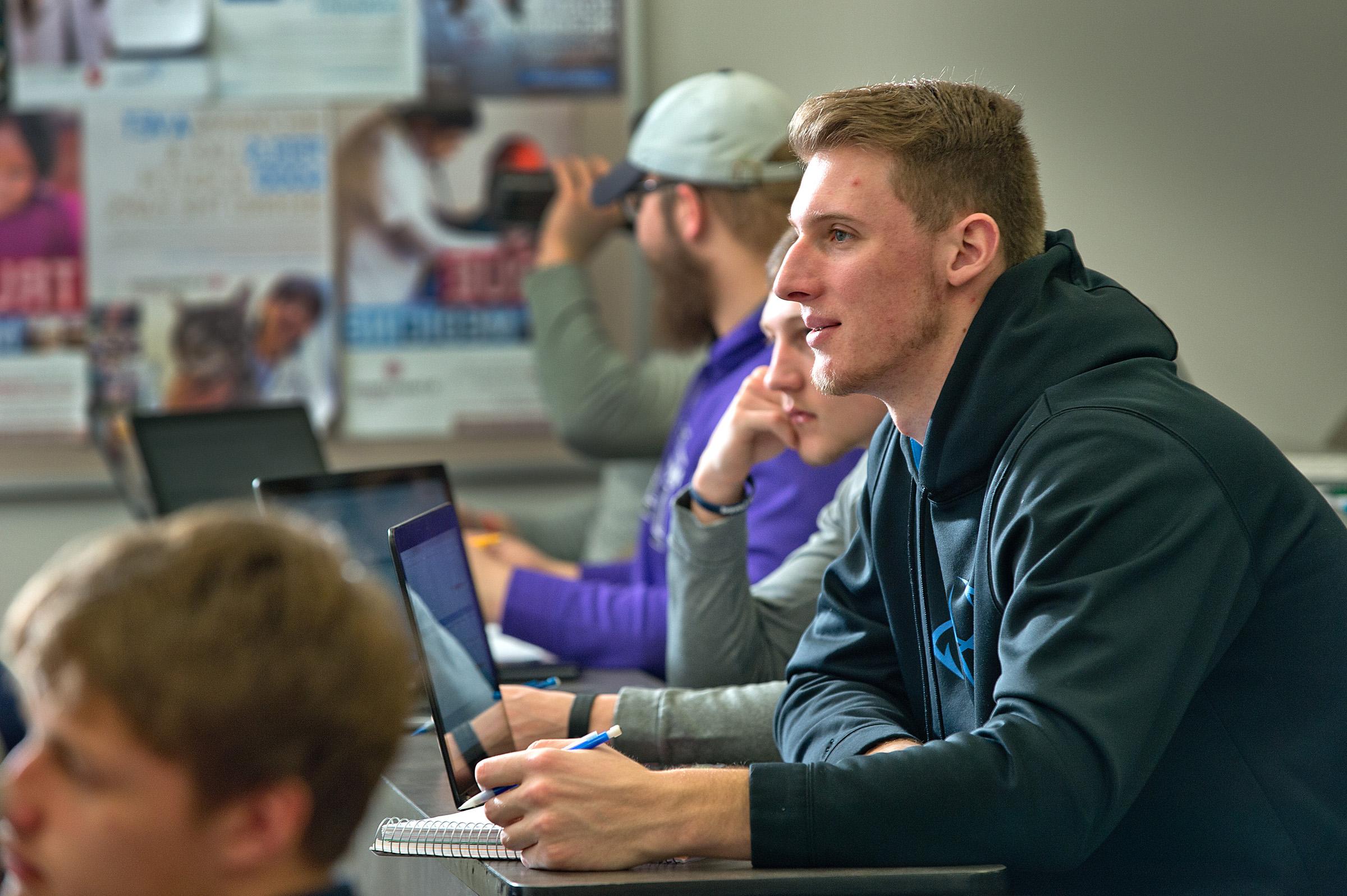 student smiling in class